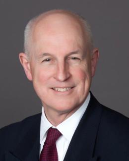 A professional headshot of Ian Duncan